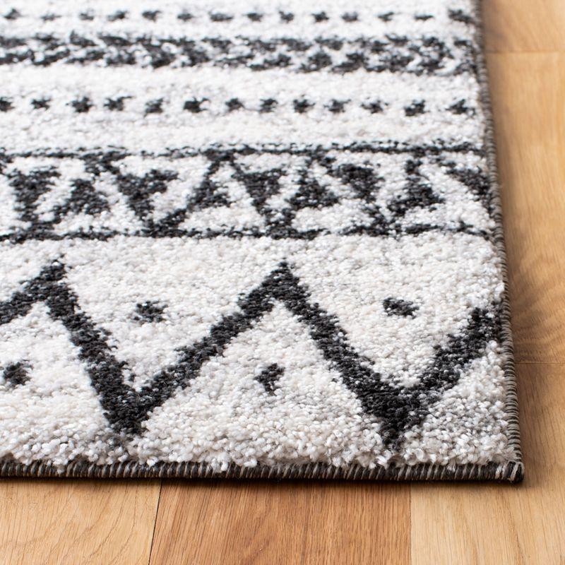 Berber Tribes Inspired 4' x 6' Black Geometric Synthetic Area Rug