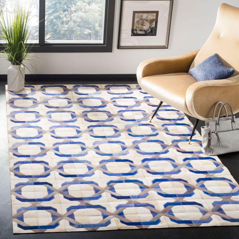 Hand-Stitched Ivory Geometric Cowhide Area Rug - 8' x 10'