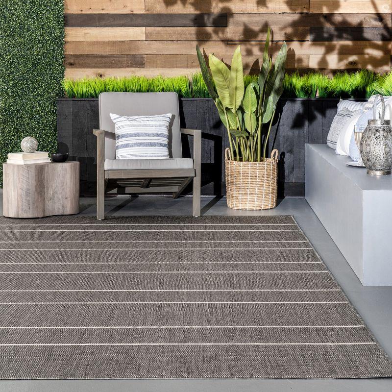 Randall Striped Machine Woven / Power Loomed Indoor/Outdoor Patio Rug