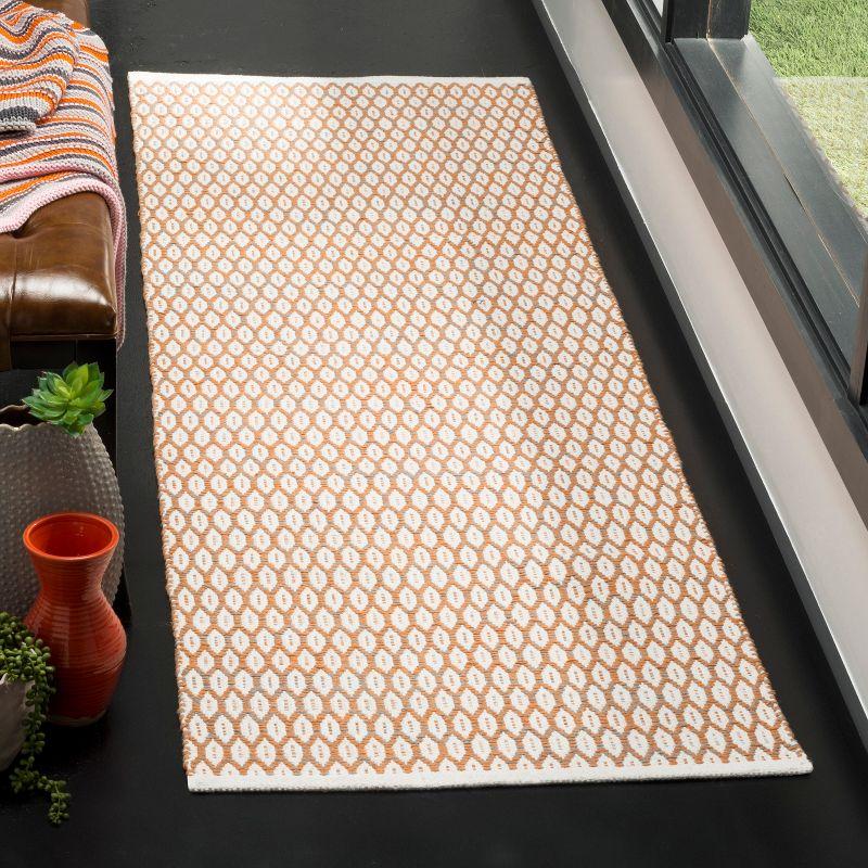 Ivory and Orange Handwoven Cotton Area Rug