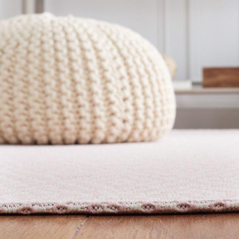 Handmade Pink and Ivory Wool 5' x 7' Reversible Braided Rug