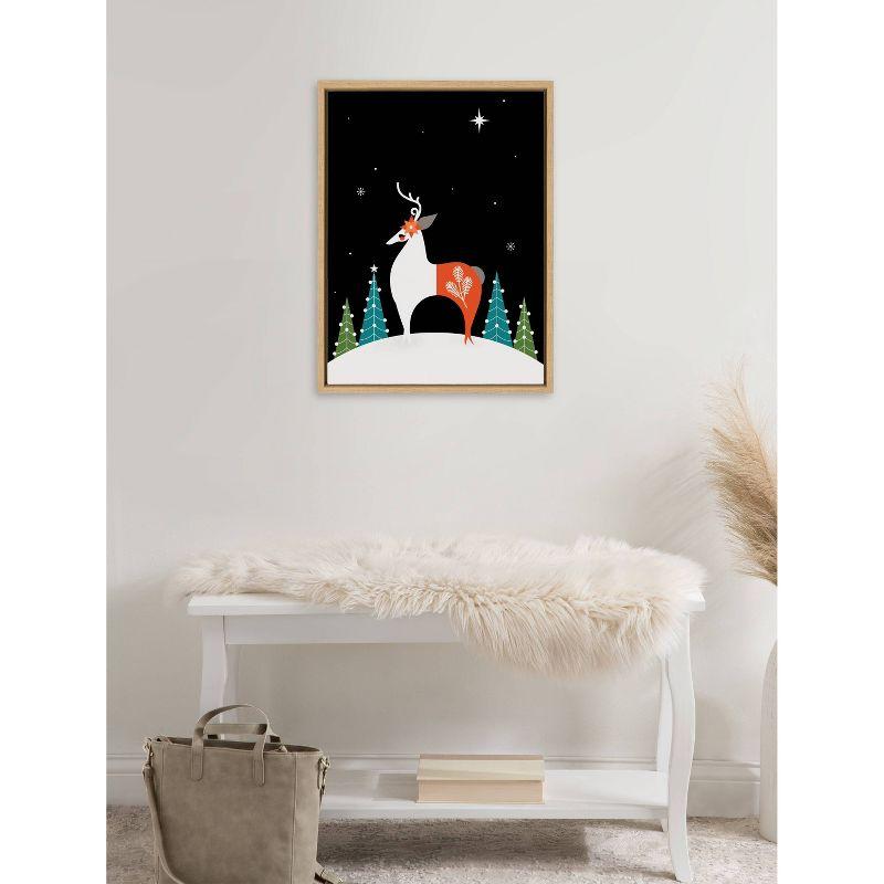 Kate & Laurel All Things Decor 18"x24" Sylvie Season's Greetings Reindeer Framed Canvas Wall Art by Amber Leaders Designs