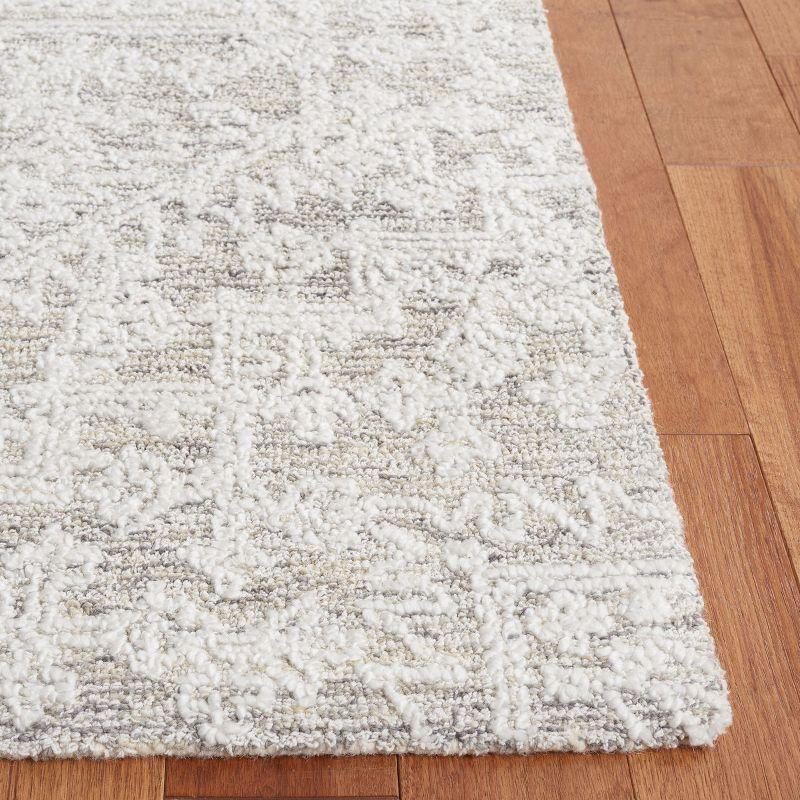 Ivory and Silver 8' x 10' Tufted Wool Area Rug