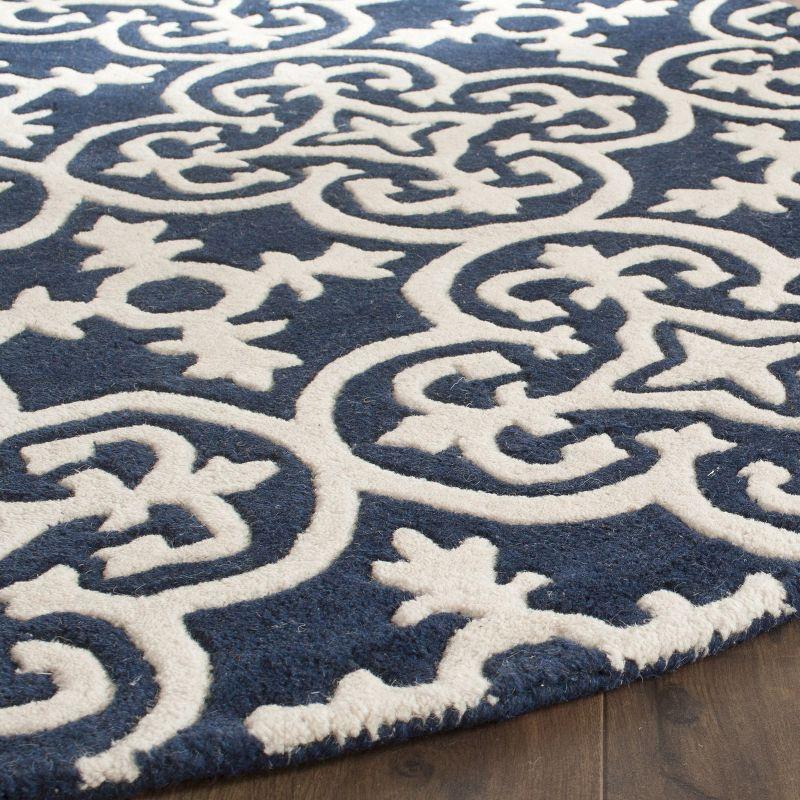 Handmade Round Blue and Ivory Wool Tufted Area Rug