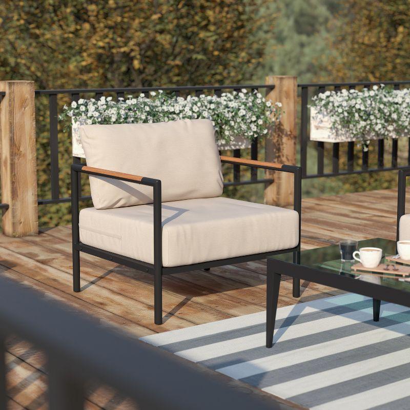 Modern Black Steel Patio Chair with Beige Cushion Accents
