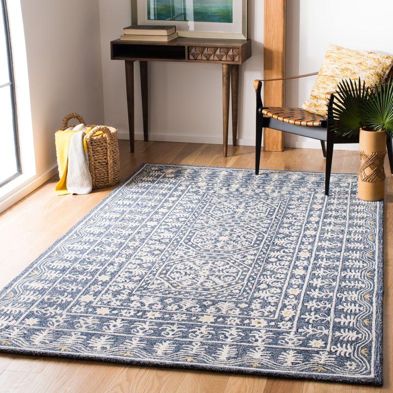 Handmade Blue and Ivory Tufted Wool Area Rug