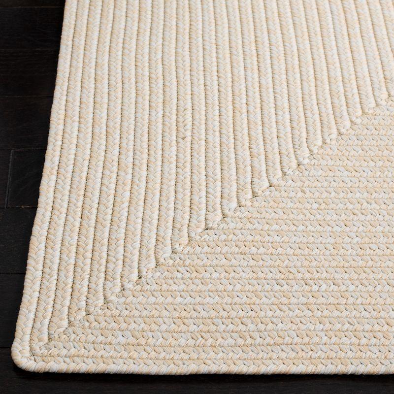 Handwoven Ivory Braided 5' x 8' Synthetic Area Rug