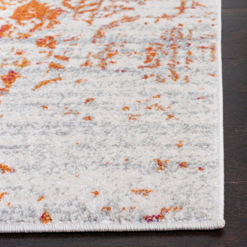 Ivory and Orange Rectangular Synthetic Area Rug