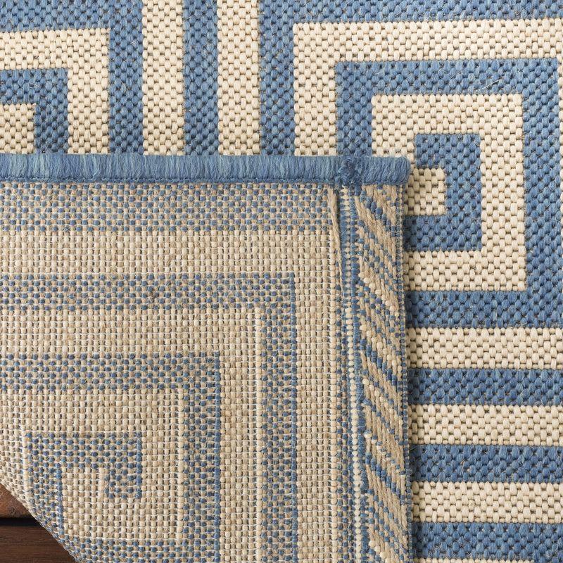 Cream and Blue Geometric 3' x 5' Stain-Resistant Synthetic Rug