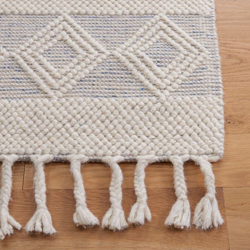 Ivory and Beige Handwoven Wool Area Rug with Fringe