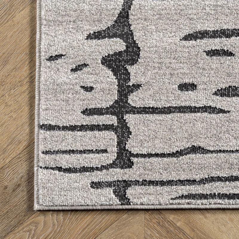 Ivory Abstract Synthetic 5' x 7' Easy Care Area Rug