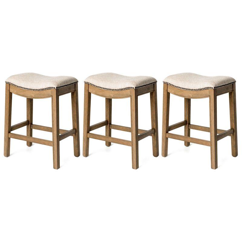 Maven Lane Adrien 26 Inch Counter Height Upholstered Backless Saddle Barstool in Natural Wood Finish with Wheat Cream Fabric Cushion Seat, Set of 3