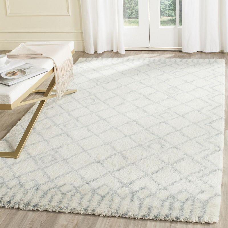 Ivory and Blue 4' x 6' Hand-Tufted Wool Shag Rug