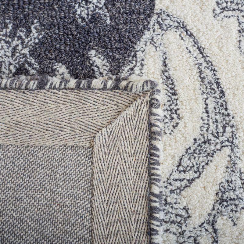Ikat IKT653 Hand Tufted Area Rug - Ivory/Black - 5'x8' - Safavieh.