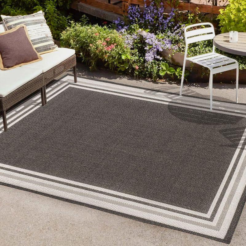 5' x 8' James Modern Border Stripe Indoor/Outdoor Area Rug, Black/Cream - JONATHAN Y