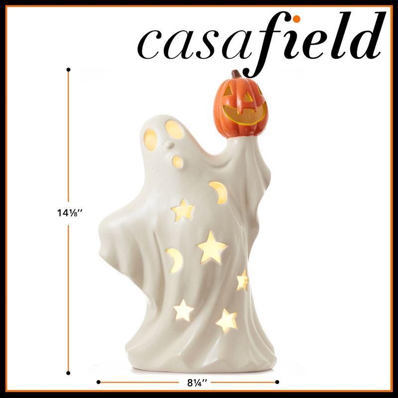 Pre-Lit Ceramic Halloween Ghost Holding Pumpkin Hand-Painted Decor