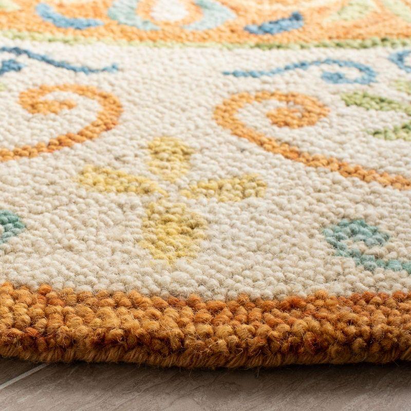 Handmade Round Rust and Ivory Wool Tufted Rug