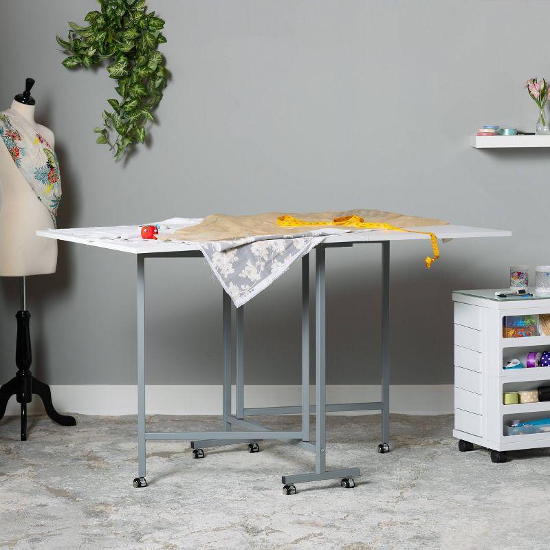 Sew Ready 58.75'' x 36.5'' Foldable Craft Table with Wheels