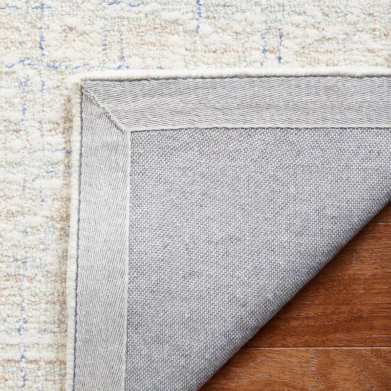 Ebony EBN111 Hand Tufted Area Rug - Blue/Ivory - 5'x8' - Safavieh.