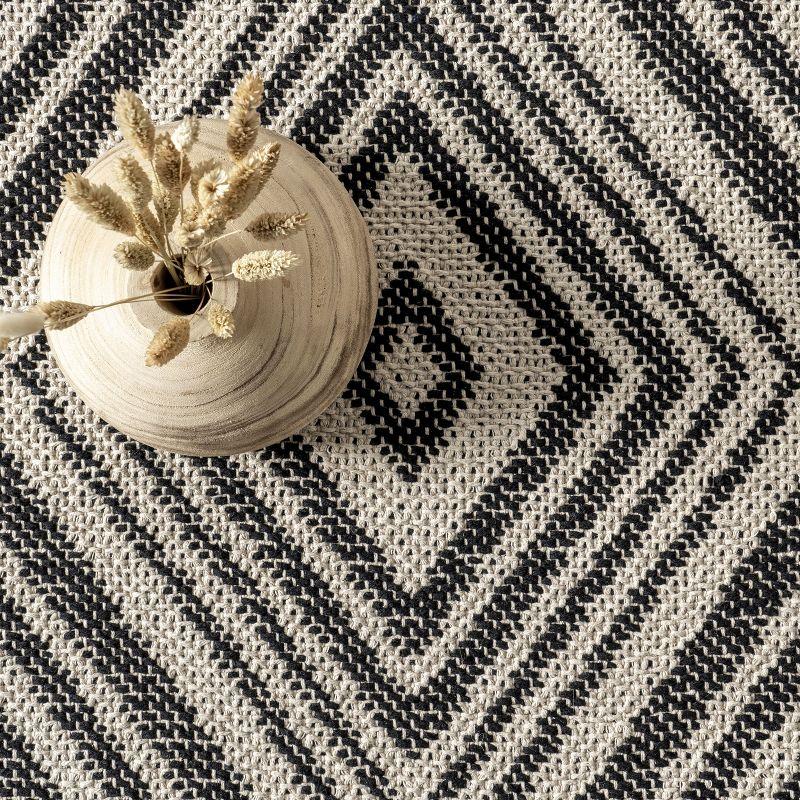 Danny Geometric Cotton Tassel Area Rug