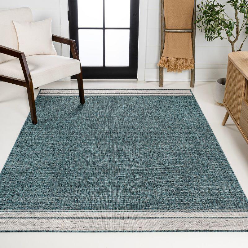 Turquoise and Cream 4' x 6' Solid Synthetic Area Rug