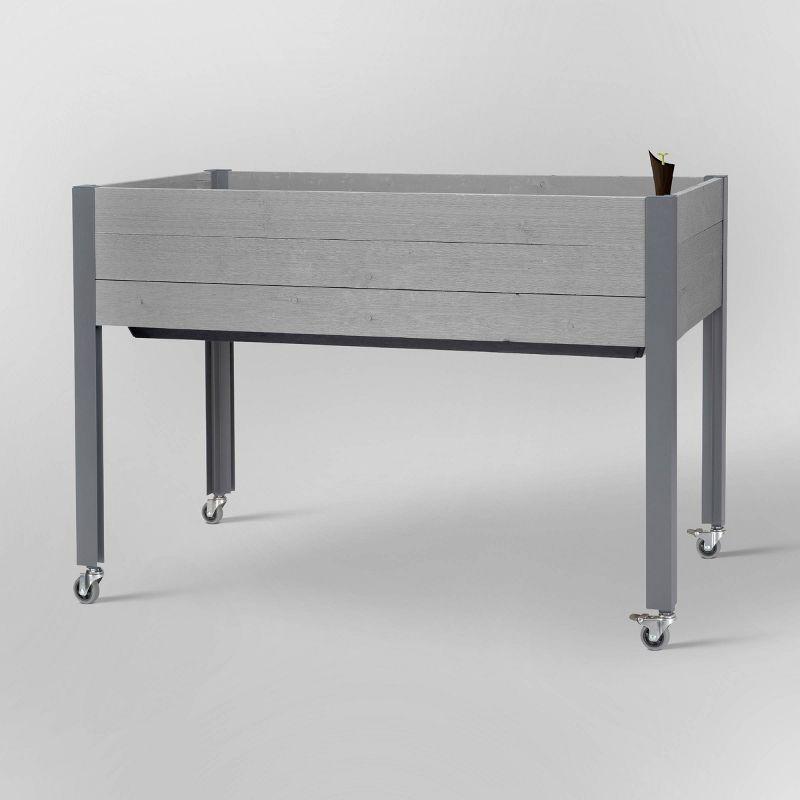 47" Gray Self-Watering Elevated Cedar Planter with Casters