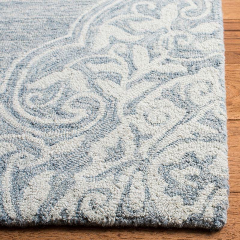 Handmade Tufted Blue and Ivory Wool Area Rug