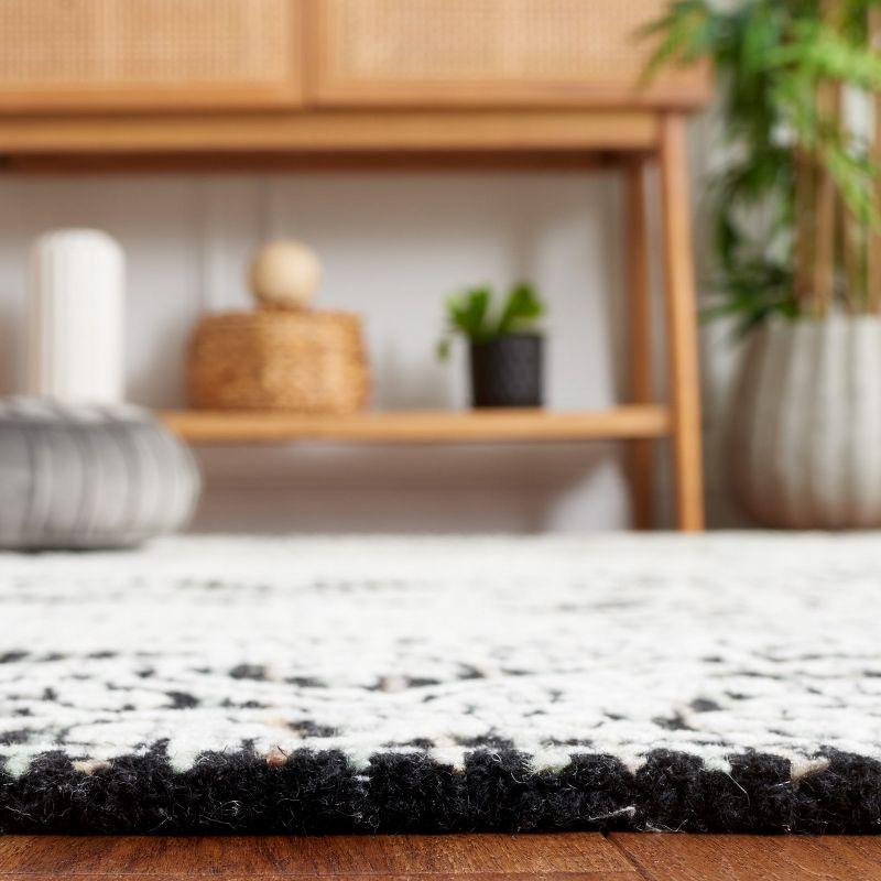 Ebony EBN114 Hand Tufted Area Rug - Black/Ivory - 6'x9' - Safavieh.