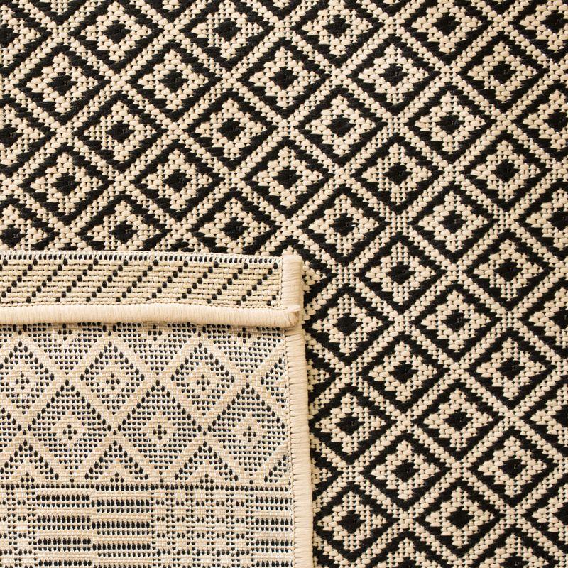 Modern Beige and Black Synthetic Indoor/Outdoor Area Rug - 5'3" x 7'7"