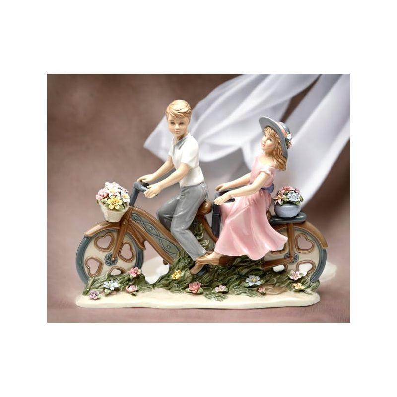 Charming Ceramic Couple on Bicycle Figurine with Floral Details