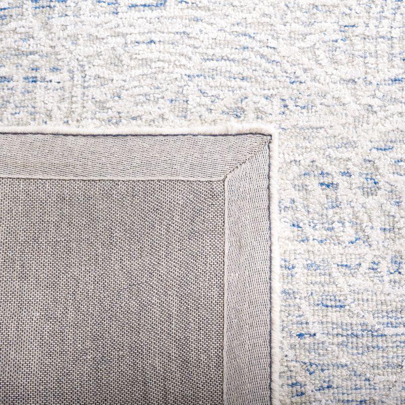 Blue and Ivory Tufted Wool Geometric Area Rug 5' x 8'