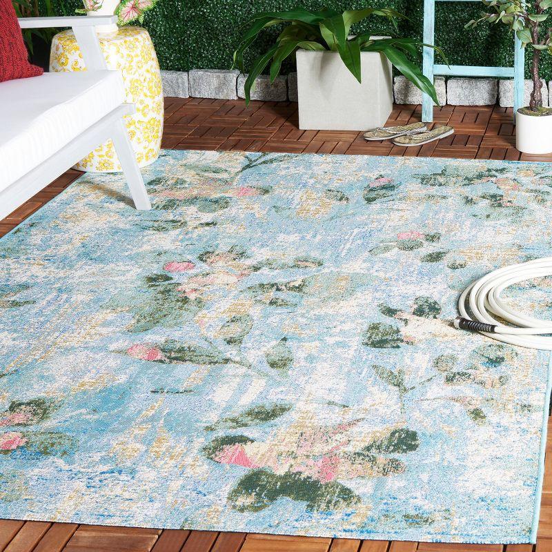 Reversible Light Blue Synthetic 4' x 6' Stain-Resistant Area Rug