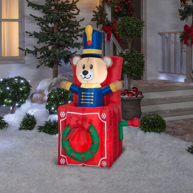 Gemmy Animated Christmas Airblown Inflatable Bear Pop Up, 5 ft Tall, Multicolored