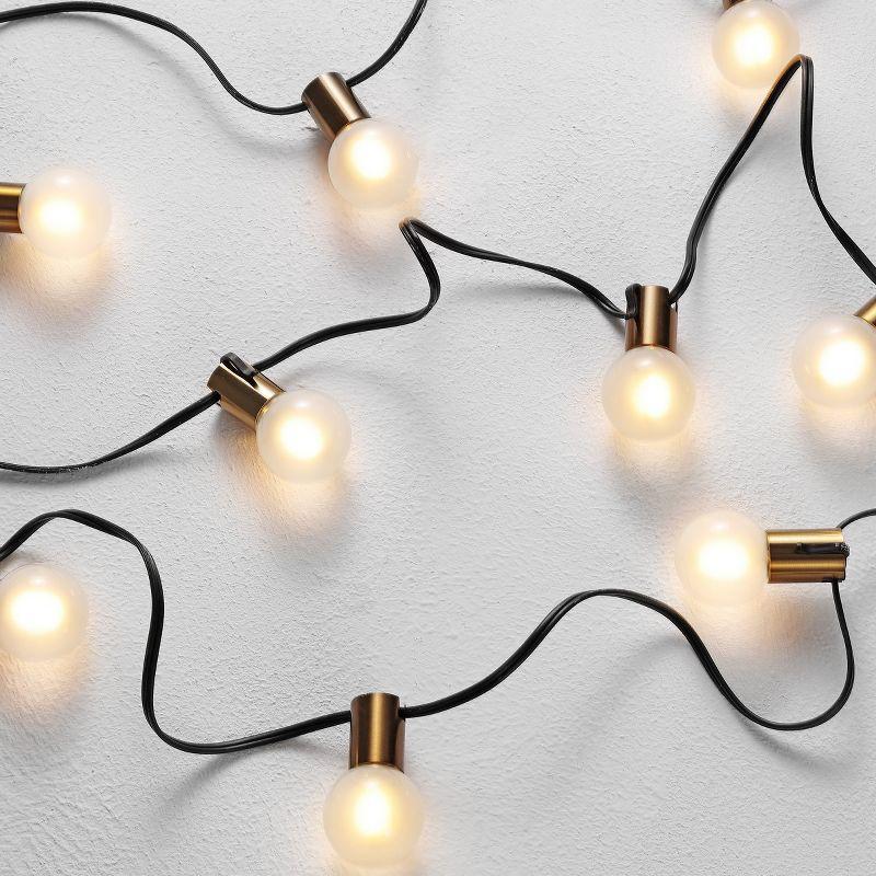 Farrynn Outdoor String Lights - Brass / Black - Safavieh..