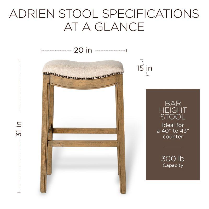 Maven Lane Adrien 31 Inch Bar Height Upholstered Backless Saddle Barstool in Natural Wood Finish with Wheat Cream Fabric Cushion Seat, Set of 2