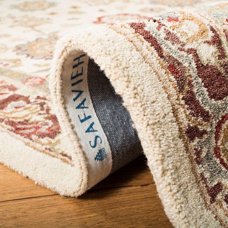 Handmade Ivory and Brown Tufted Wool Round Rug