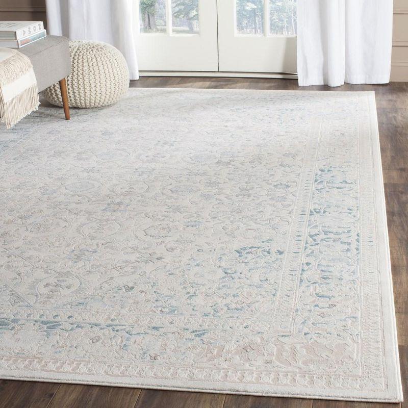 Ivory and Turquoise Rectangular Reversible Synthetic Area Rug