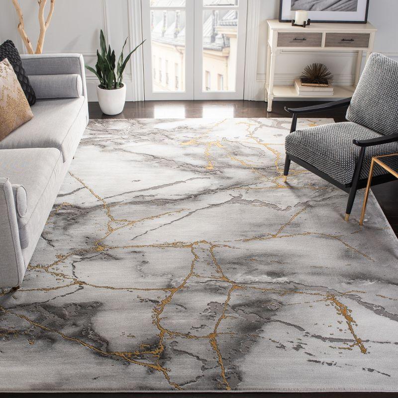 Abstract Swirls Grey and Gold 9' x 12' Synthetic Reversible Rug