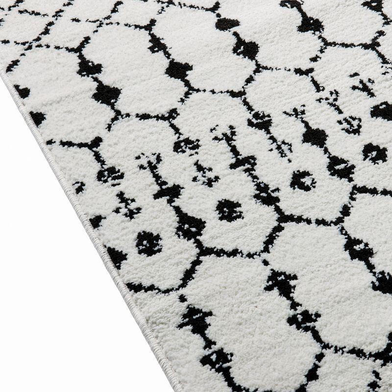 Emma and Oliver Modern Design Geometric Bohemian Low Pile 8' x 10' Ivory And Black Area Rug