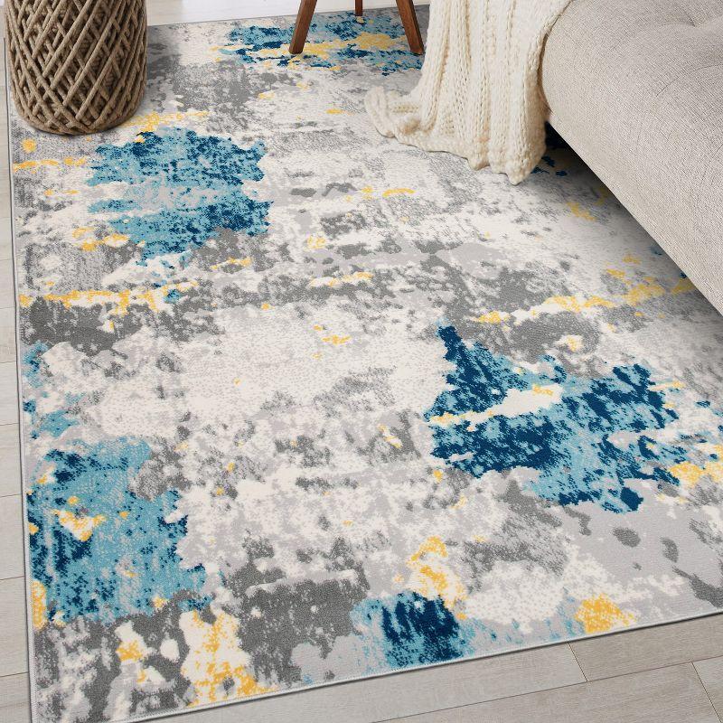 Cream and Blue Abstract Synthetic 5' x 7' Area Rug