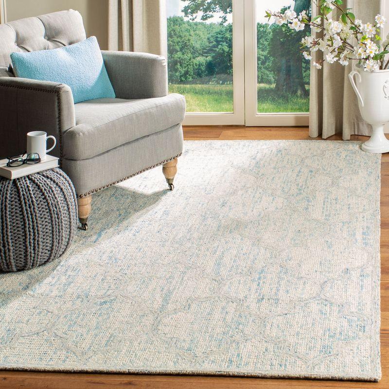 Ivory and Light Blue Abstract Wool 6' x 9' Area Rug