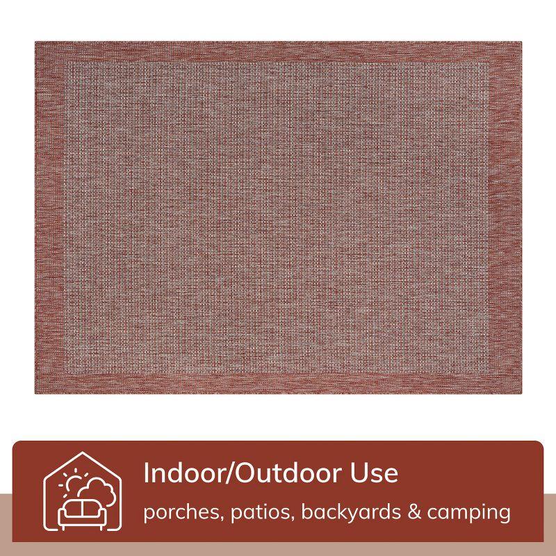 Marshanna Odin Solid Striped Border Indoor Outdoor Coral Flatweave Rug