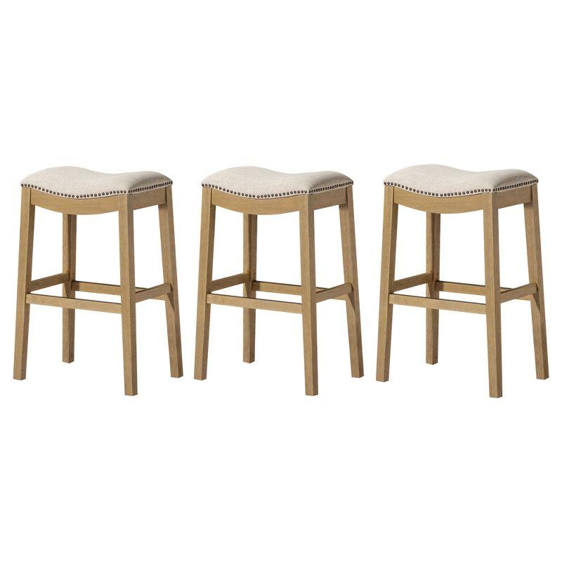 Maven Lane Adrien 26 Inch Counter Height Upholstered Backless Saddle Barstool in Natural Wood Finish with Wheat Cream Fabric Cushion Seat, Set of 3