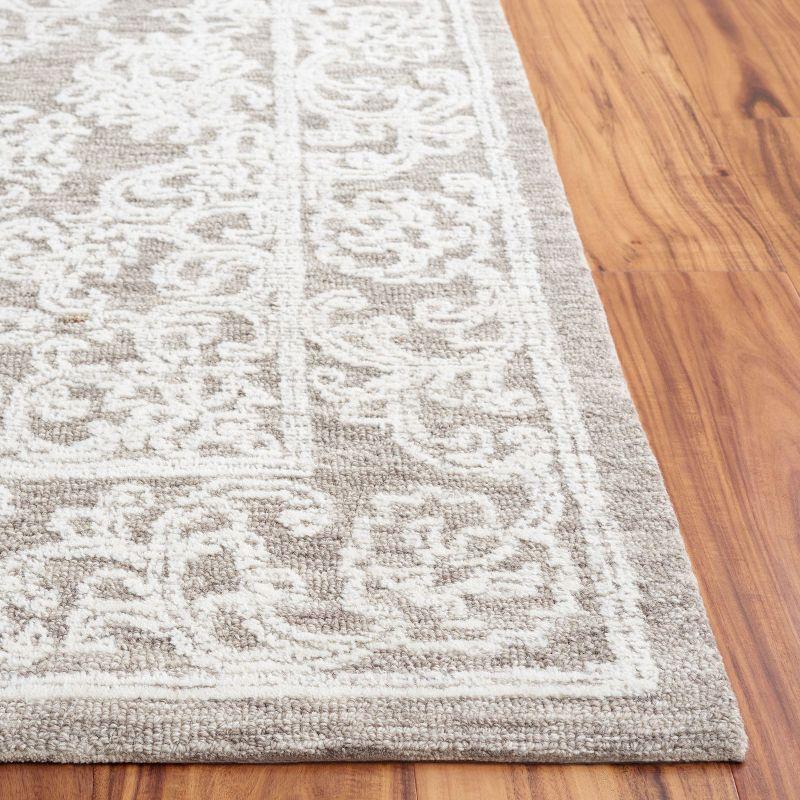 Ivory and Dark Grey 4' x 6' Hand Tufted Wool Area Rug