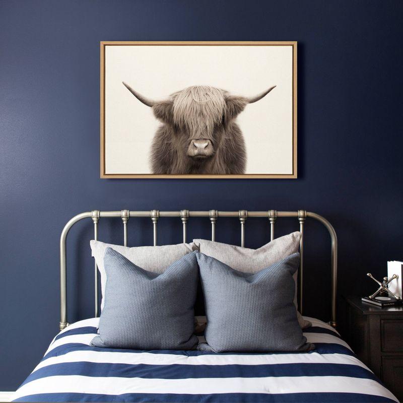 23" x 33" Sylvie Highland Cow Color Framed Canvas by The Creative Bunch Studio Natural - Kate and Laurel