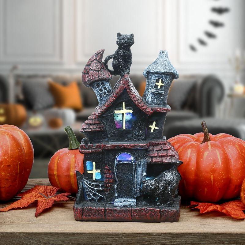 The Holiday Aisle® 7" Black Cats Halloween Haunted House with LED Light