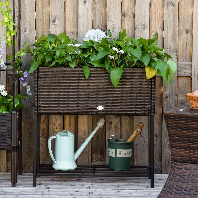 Outsunny Outdoor Flower Stand with legs, Rattan Wicker Look, Tool Storage Shelf, Portable Design for Herbs, Vegetables, Flowers, Brown