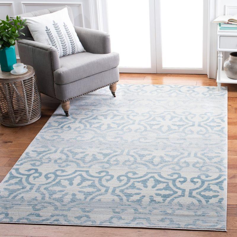 Ivory and Turquoise 8' x 10' Hand-Knotted Synthetic Area Rug