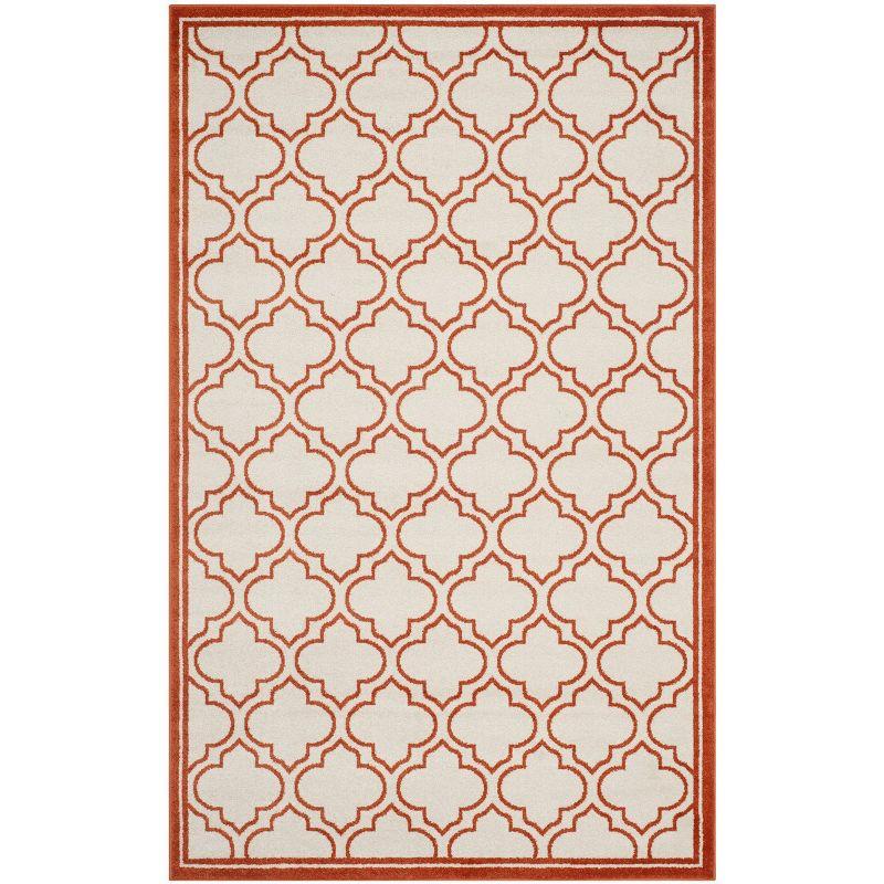 Ivory and Orange Geometric Low Pile Area Rug