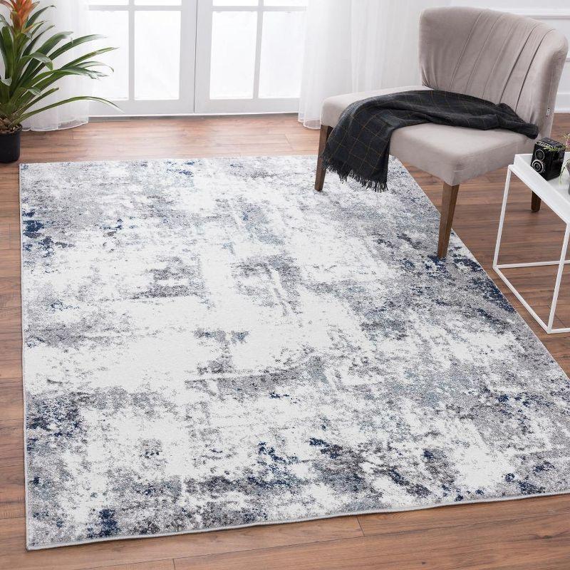 Abstract Ivory Synthetic 5' x 7' Easy-Care Area Rug